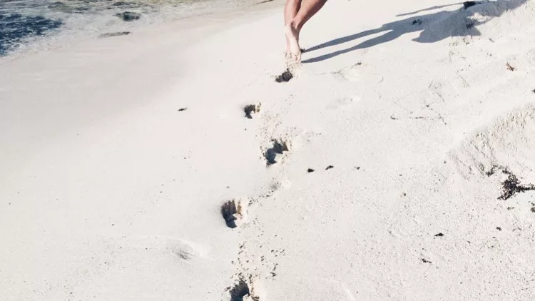 running on the sand and leaving prints